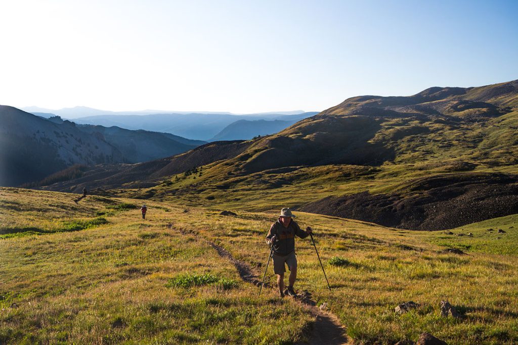 A man hikes the trail to Uncompahgre Peak, a 14er (14,000+-foot mountain) near Lake City, Colorado